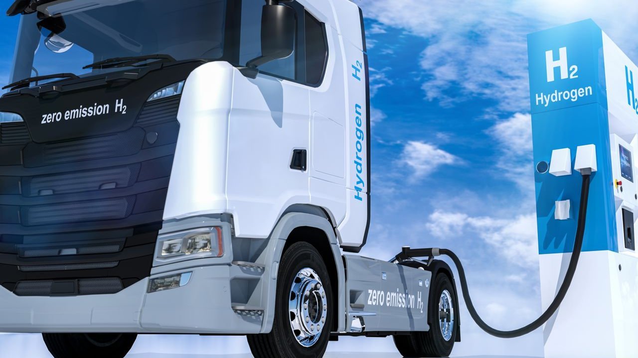 Truck at fuel filling station with hydrogen symbol